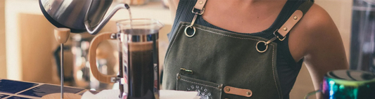 A barista pouring coffee